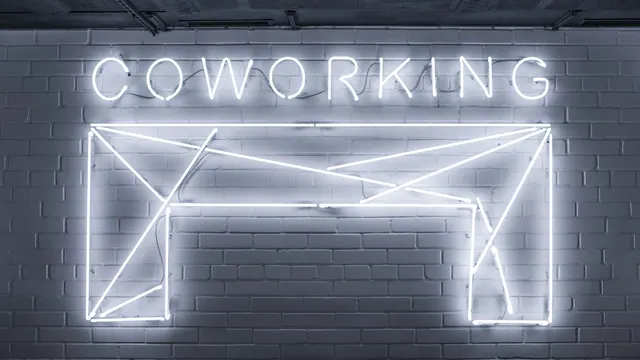 closeup photo of Co Working neon light sign Coworking Neon Sign. Coworking space insurance costs and coverage